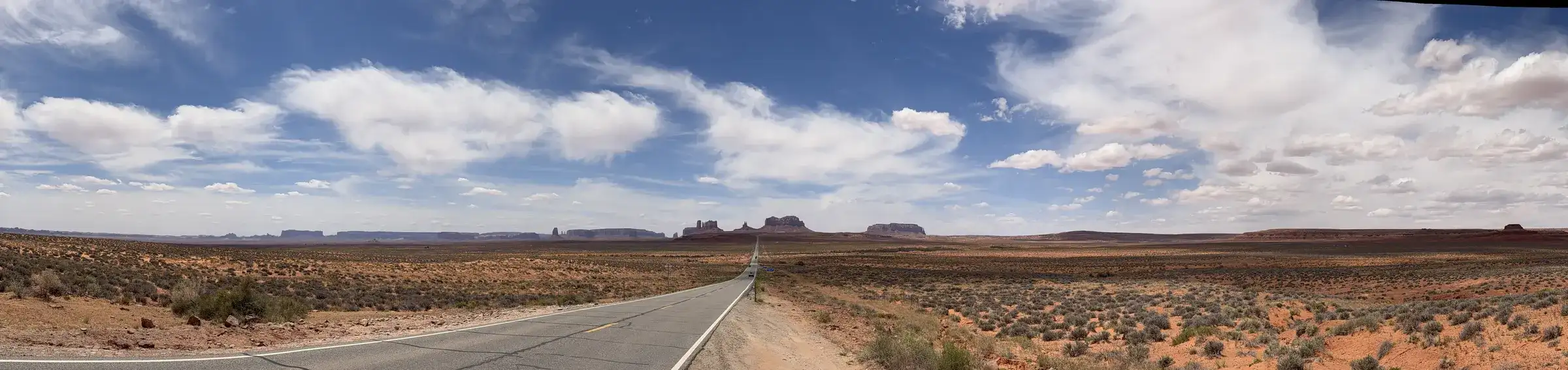 Open desert road under a wide sky